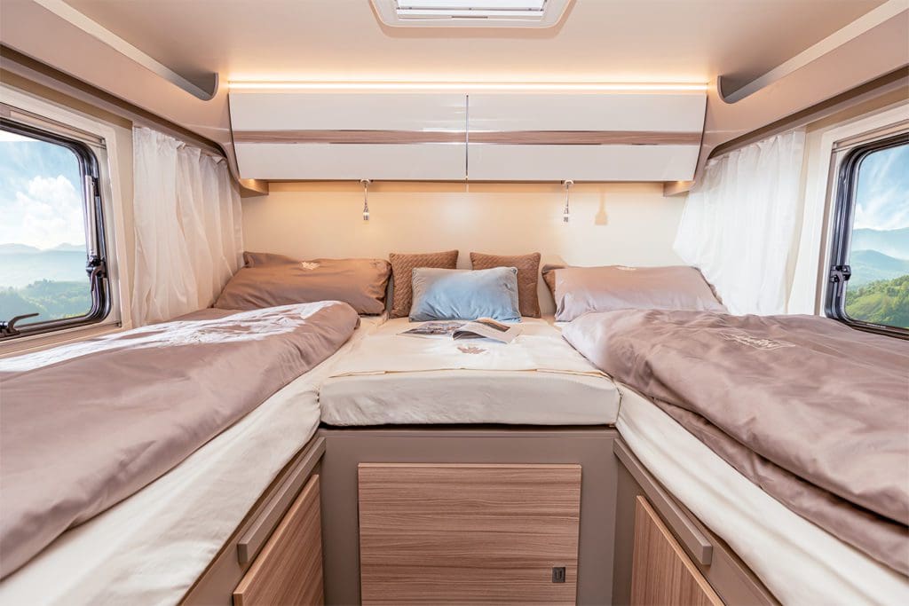 The single beds in the ACA 690 can be converted into a large double bed with a centre cushion.